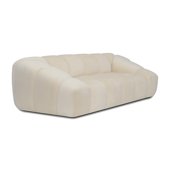 Nowoczesna sofa BETINA o zaokrąglonej formie i głębokim pikowaniu