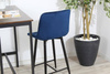 Welurowe krzesło barowe niskie PROXI pikowane granatowe na czarnych nogach